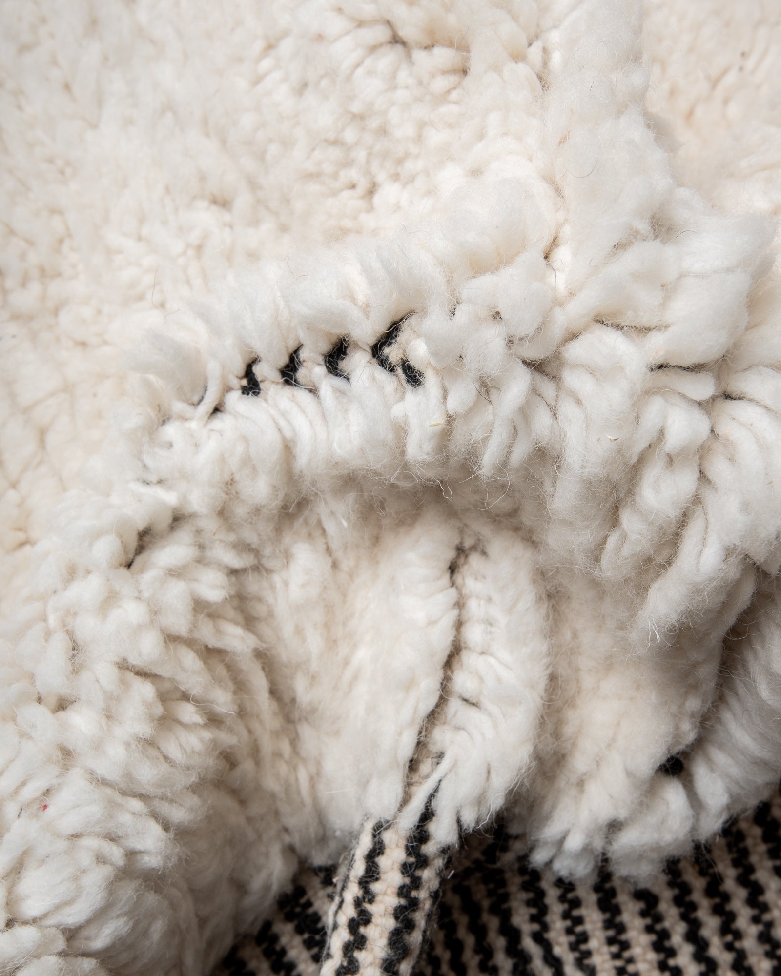 Modern, designer, handcrafted Berber rug from Morocco. Beniourain carpet with beautiful colours and patterns and fluffy wool texture.